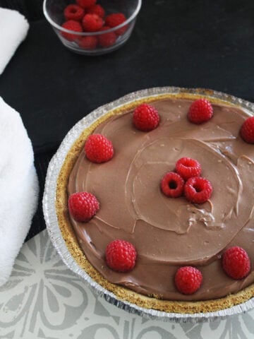 beautiful chocolate cheesecake with raspberries
