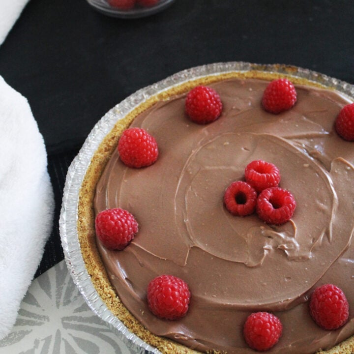 beautiful chocolate cheesecake with raspberries