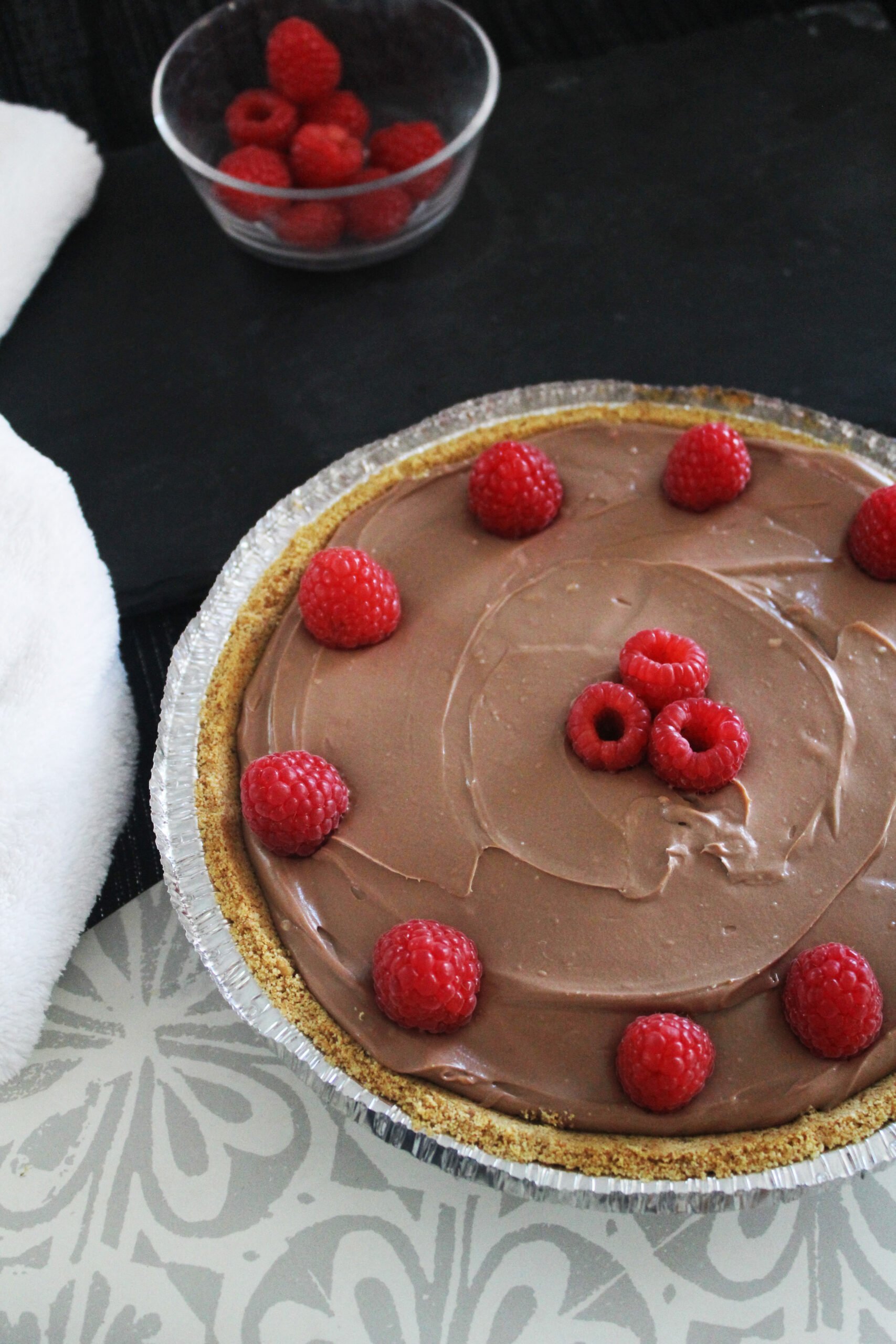 beautiful chocolate cheesecake with raspberries